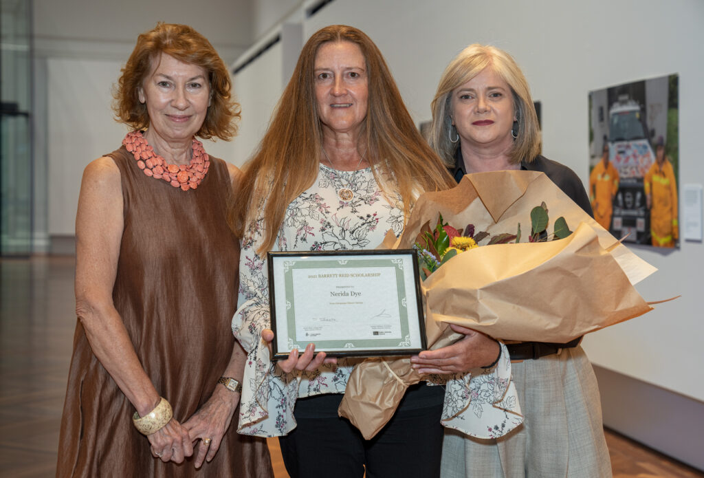 Photograph of Maxine McKew and Sarah Slade presenting the Barrett Reid Scholarship to Nerida Dye